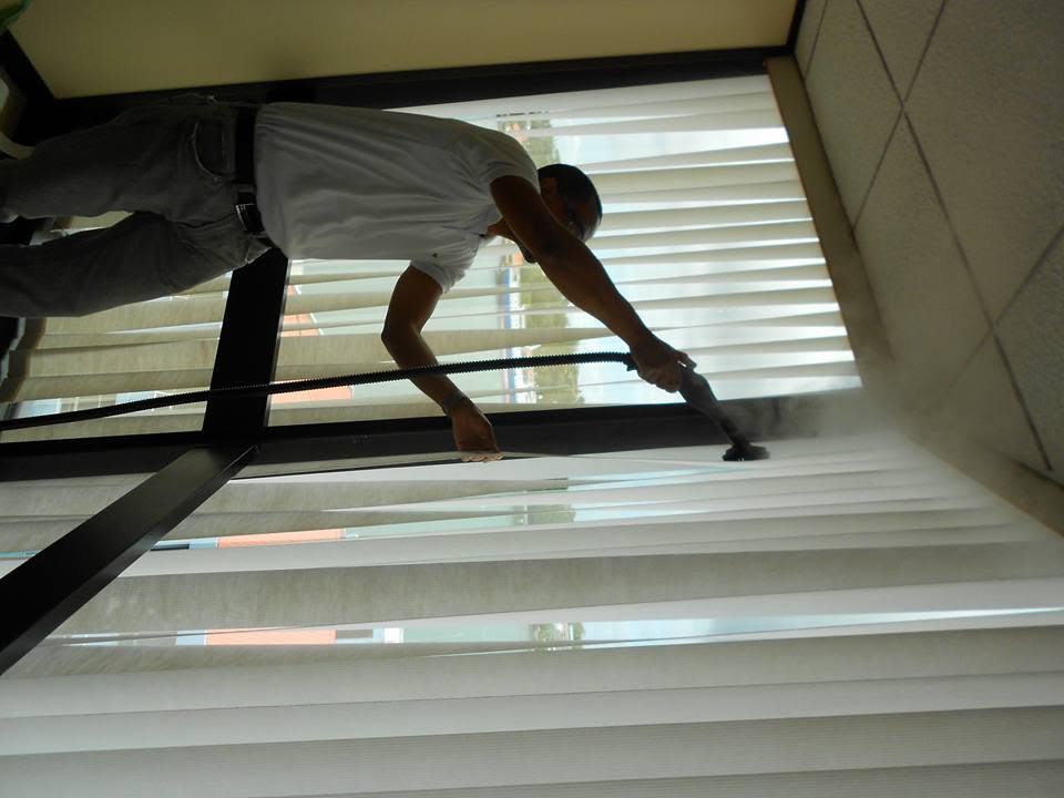 Steam cleaning office windows and vertical blinds